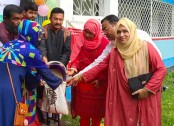 দুপচাঁচিয়ায় ওএমএস এর চাল বিক্রয় কার্যক্রমের উদ্বোধন