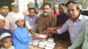 দুপচাঁচিয়ায় এতিম শিশুদের মাঝে যুবদলের খাবার বিতরণ
