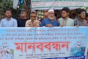 পাঁচবিবিতে  সাংবাদিকের উপর হামলায় জড়িতদের গ্রেফতার ও সুষ্ঠু বিচারের দাবিতে মানববন্ধন